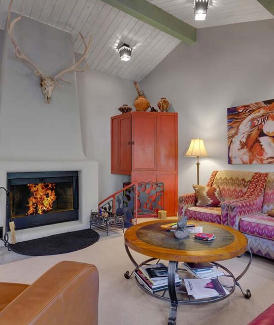 Fireplace and living area in a mountain condo.