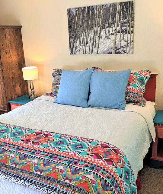colorful single bed in a condo