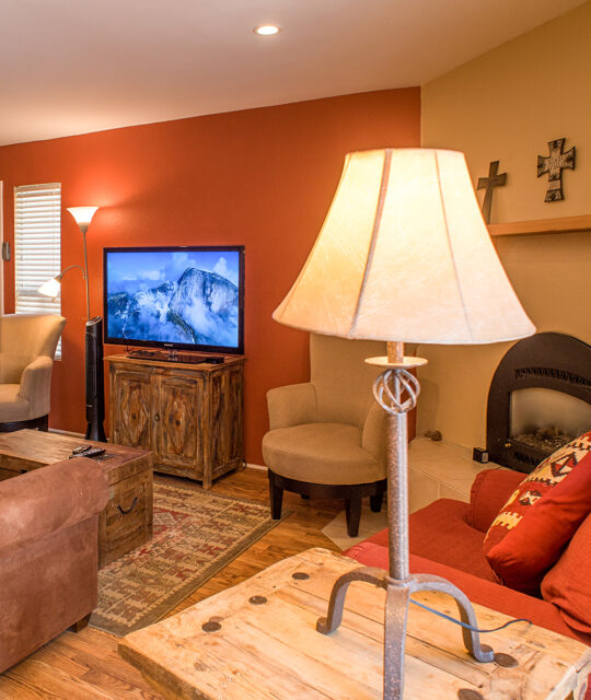 Condo living room with kiva fireplace