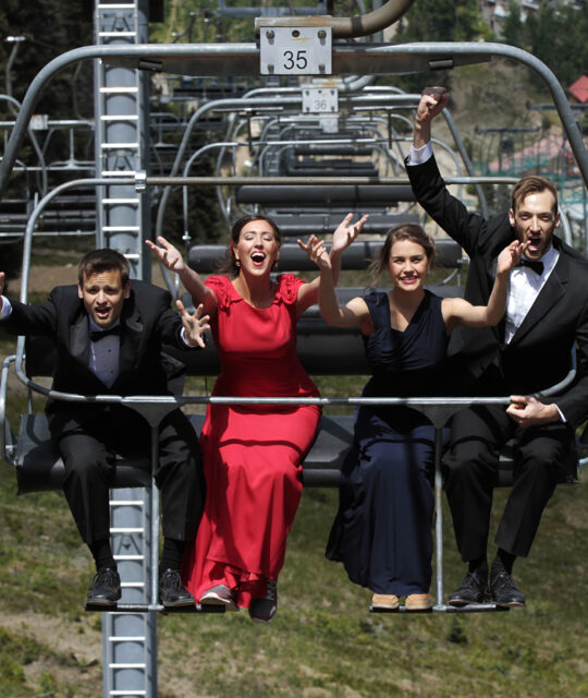 Taos Opera Institute signers on chairlift singing