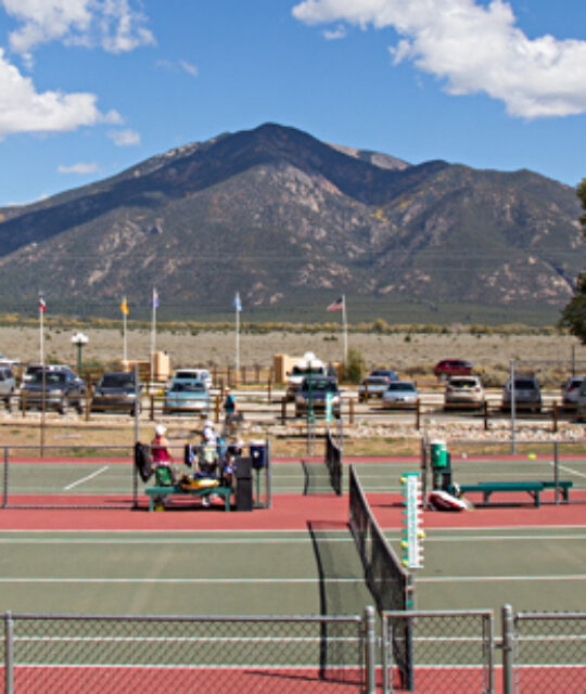 Tennis courts with Taos Mountain in background