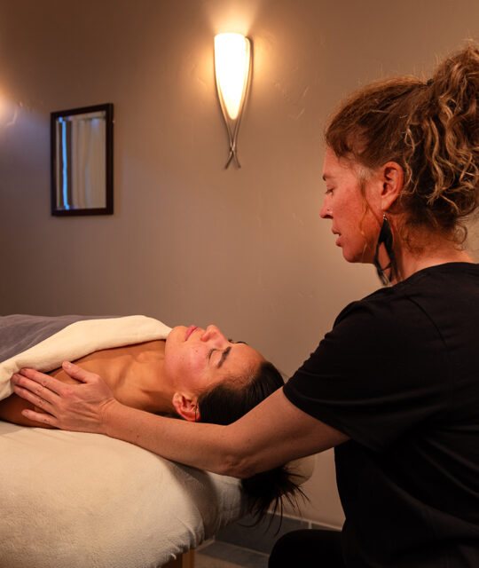 Massage therapist giving a treatment at Edelweiss Spa in Taos Ski Valley.