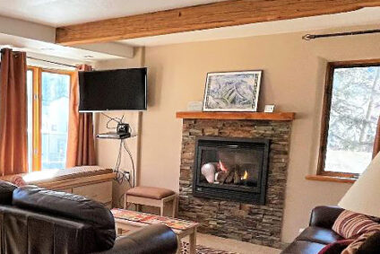 Living room and fireplace in a ski condo