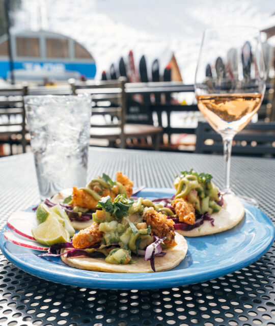 Fish tacos and glass of wine at a ski resort
