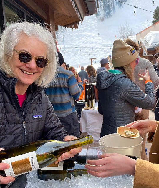 Wine rep pouring at the Taos Winter Wine Fest.