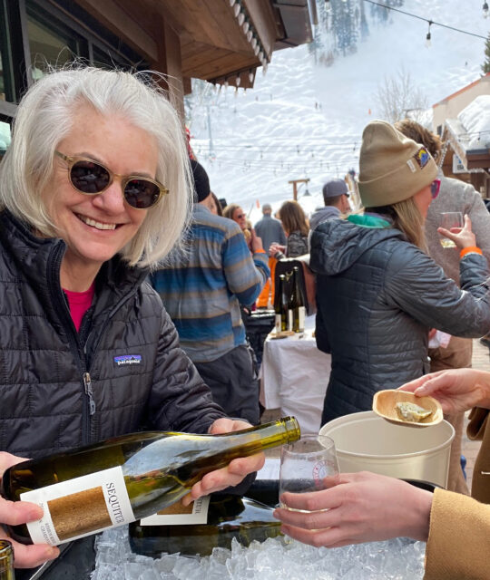 Wine rep pouring at the Taos Winter Wine Fest.