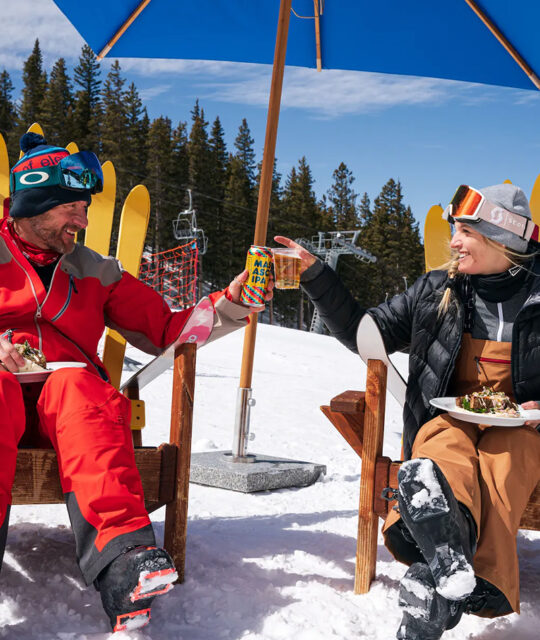 Couple toasting at the Whistlestop Cafe in Taos Ski Valley.
