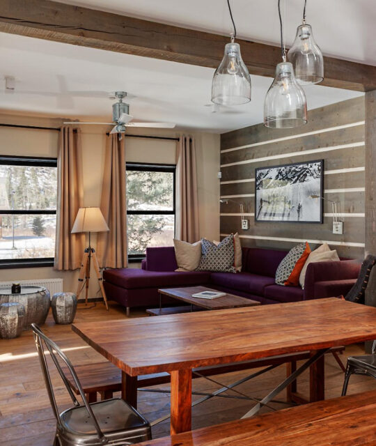 A bright modern rustic ski chalet living and dining area