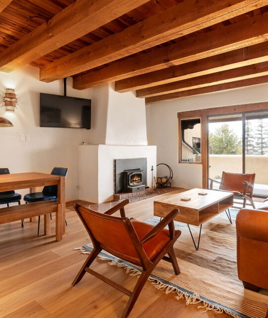 Sunny living area with southwest style fireplace