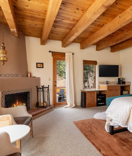 Southwest decor and kiva fireplace in bedroom