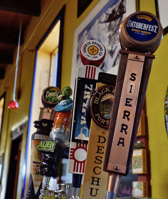 Beer taps lined up at Pizanos pizza and pasta