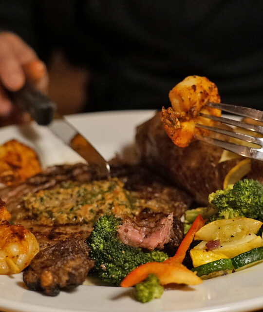 Steak and shrimp with mixed veggies.