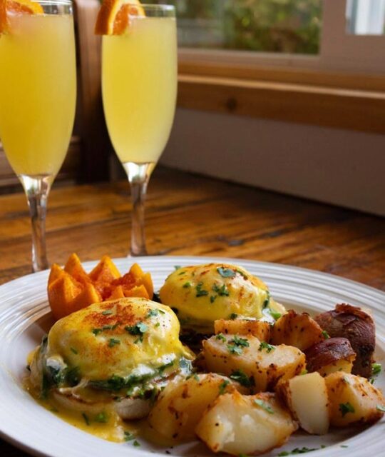 Eggs benedict with two mimosas from Bent Street Grille.
