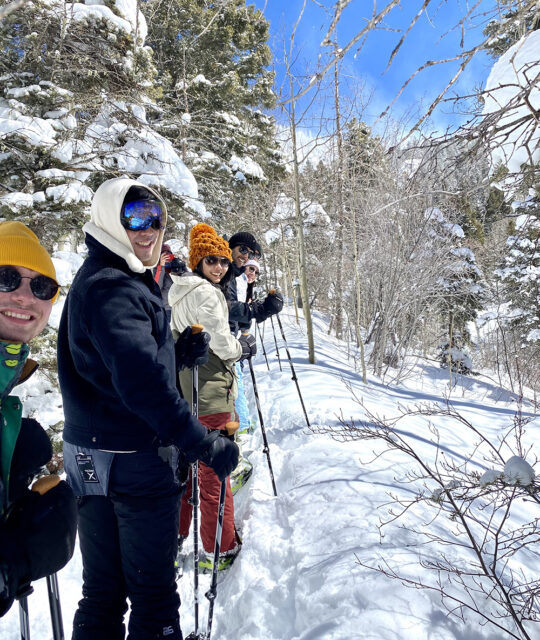 Group of friends on a guided snowshoeing tour in Taos Ski Valley