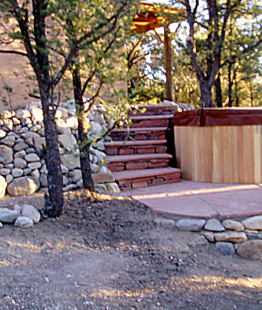 Landscaping and rock stairs and hot tub