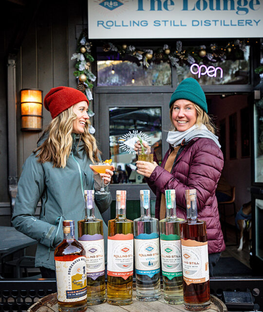 Rolling Still Vodka and two women smiling