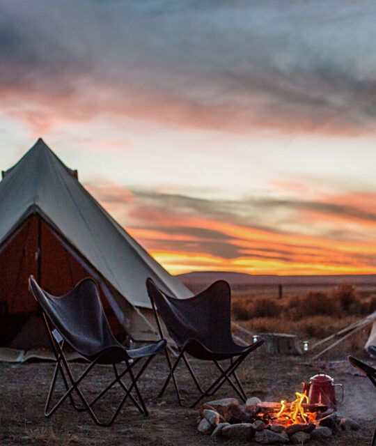 Glamping tent and colorful sunset near Taos, New Mexico.