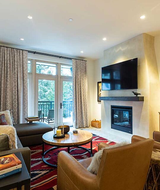 Mountain condo living room and fireplace with southwest decor.