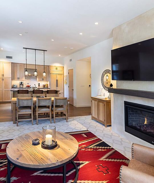 Southwest inspired condo living, fireplace and kitchen. at The Blake Residences