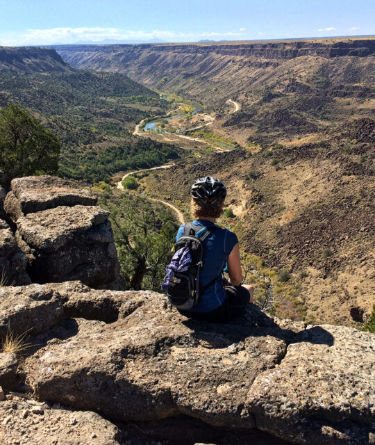 Mountain biker enjoying the view of the Rio Grande Gorge from the Rift Valley Overlook Trail.