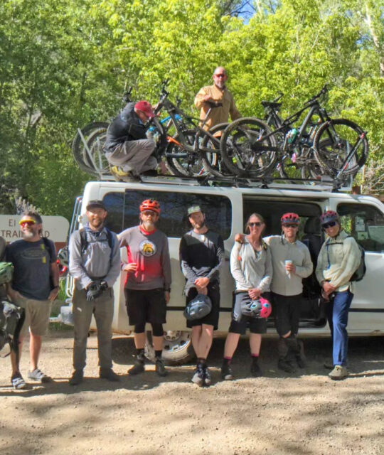 Group of mountain bikers with Taos MTB Assoc. loading up or a trail work day on South Boundary.