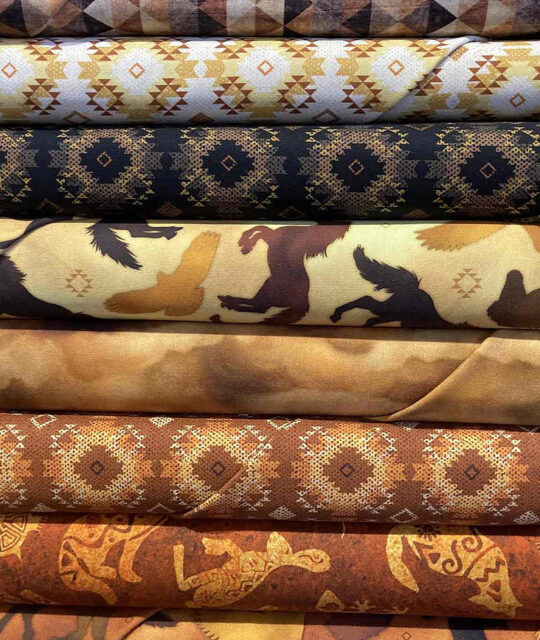 Fabric with Southwestern patterns and horses.