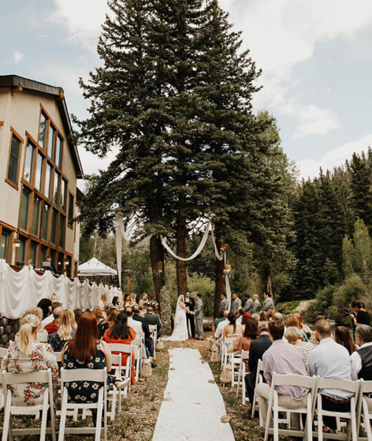 An outdoor mountain wedding ceremony.