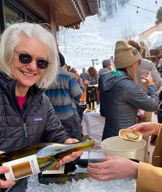 Wine rep pouring at the Taos Winter Wine Festival