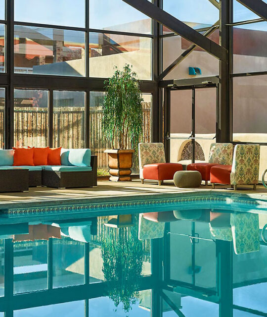 Beautiful indoor pool and colorful seating at the Hotel Don Fernando.