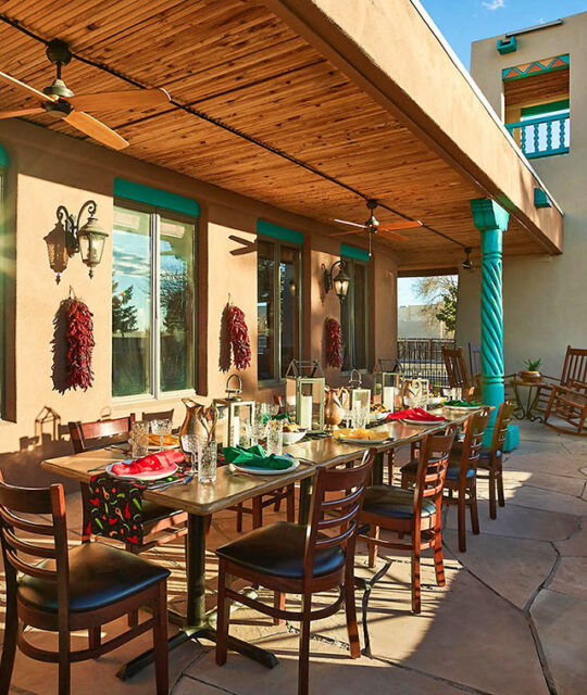 Outdoor patio dining table service in southwest inspired decor.