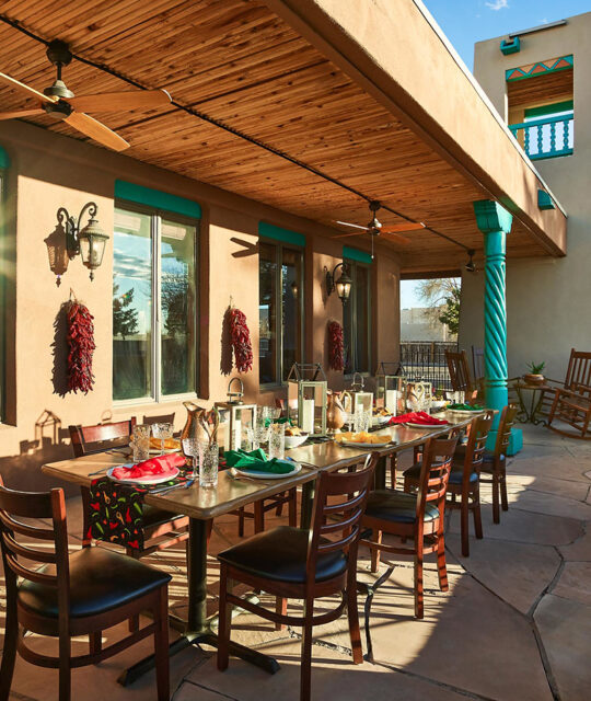 Outdoor patio dining table service in southwest inspired decor.