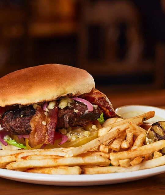 Burger with bacon and french fries.