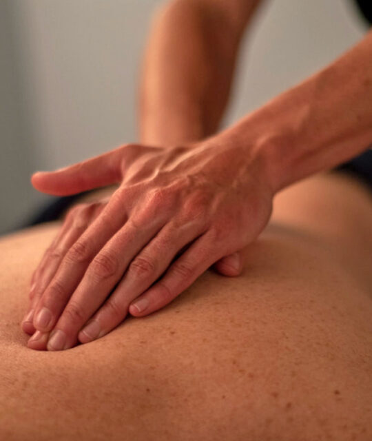 Massage therapist healing hands