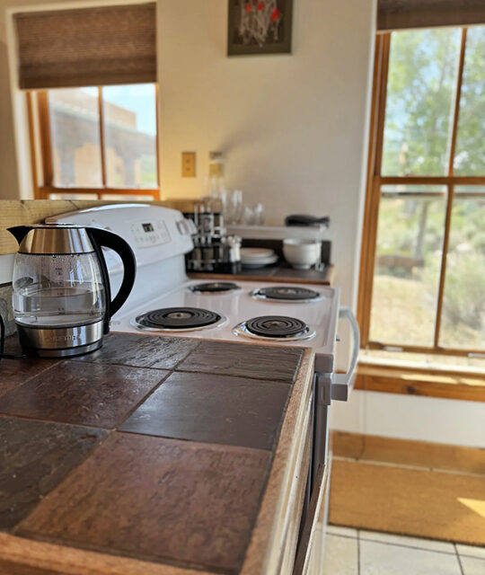 Kitchen and stove in Taos Wools Casita vacation rental.