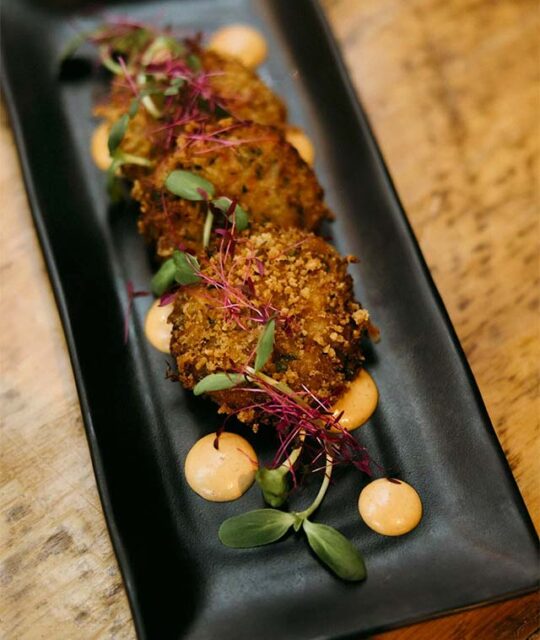 Lions Mane cakes with sunflower sprouts.