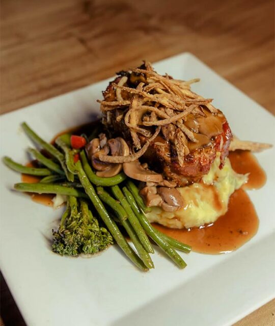 ACEQ restaurant Wangus steak over potatoes au gratin and green beans