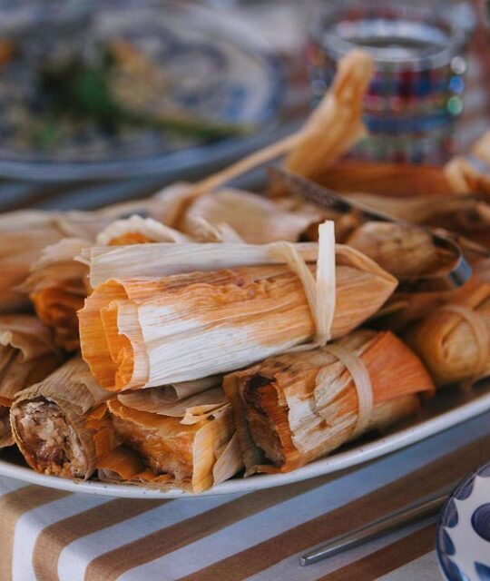 Tamales for a wedding reception and a striped tablecloth.