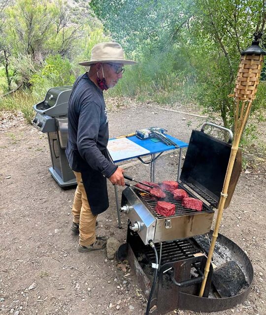 Chef Pepe grilling steaks for Big River Raft Trips.