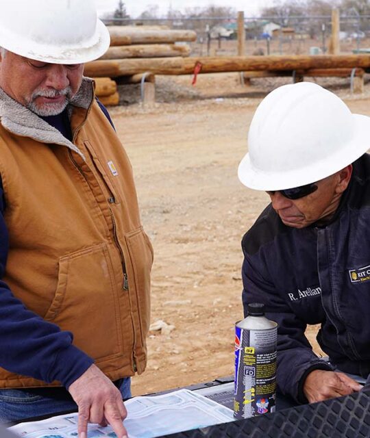 Lineman discussing a job out in the field.