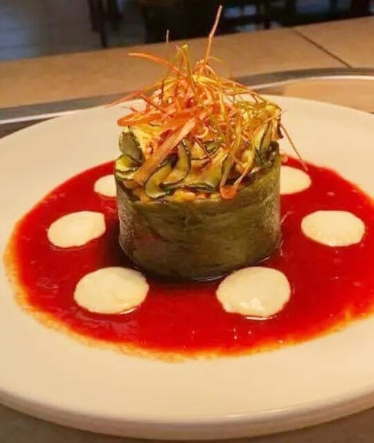 Stuffed poblano and red chili sauce.
