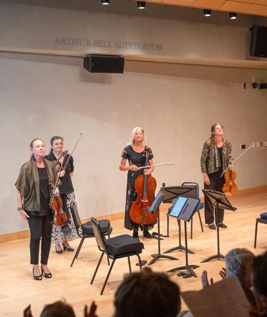 Taos Chamber Music Group musicians stand after a concert.