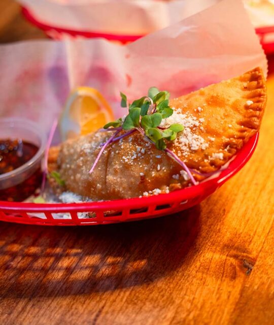 Empanadas in a red basket