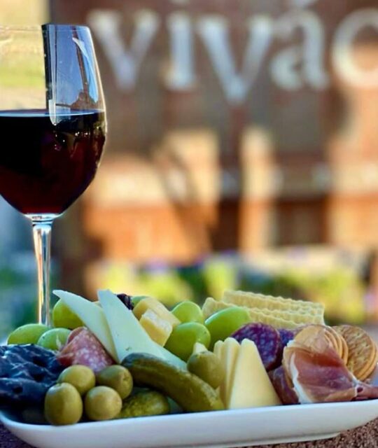 Glass of wine and antipasto plate from Vivác Winery at Dixon, New Mexico.