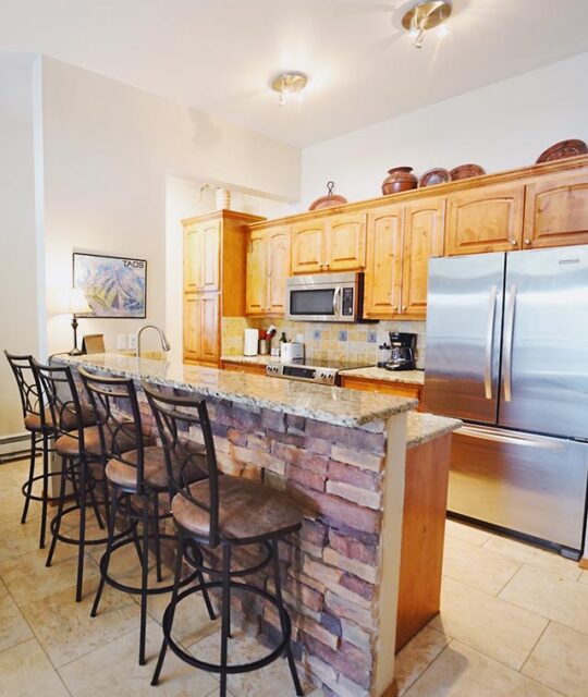 Nicely appointed condo kitchen with stainless appliances