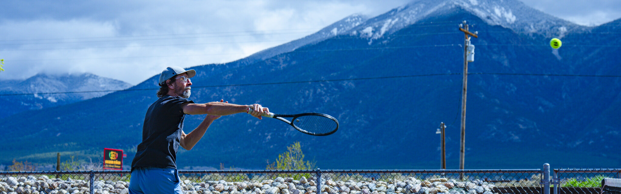 Person hitting tennis ball