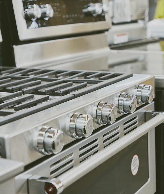 Close up of a new stainless steel range.