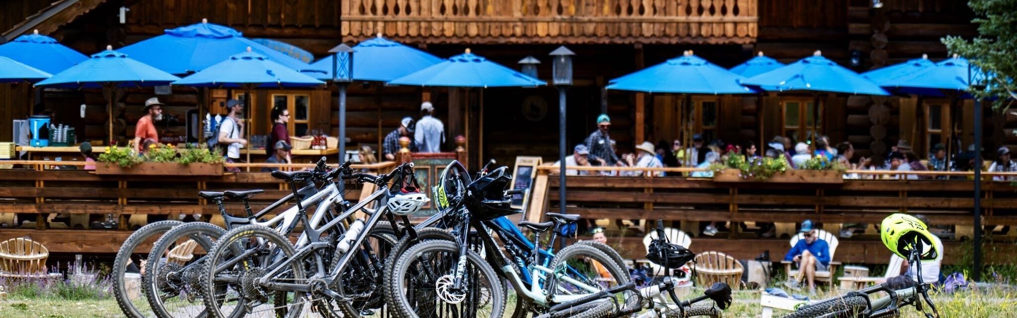 Pile of Mountain Bikes outside a restaurant